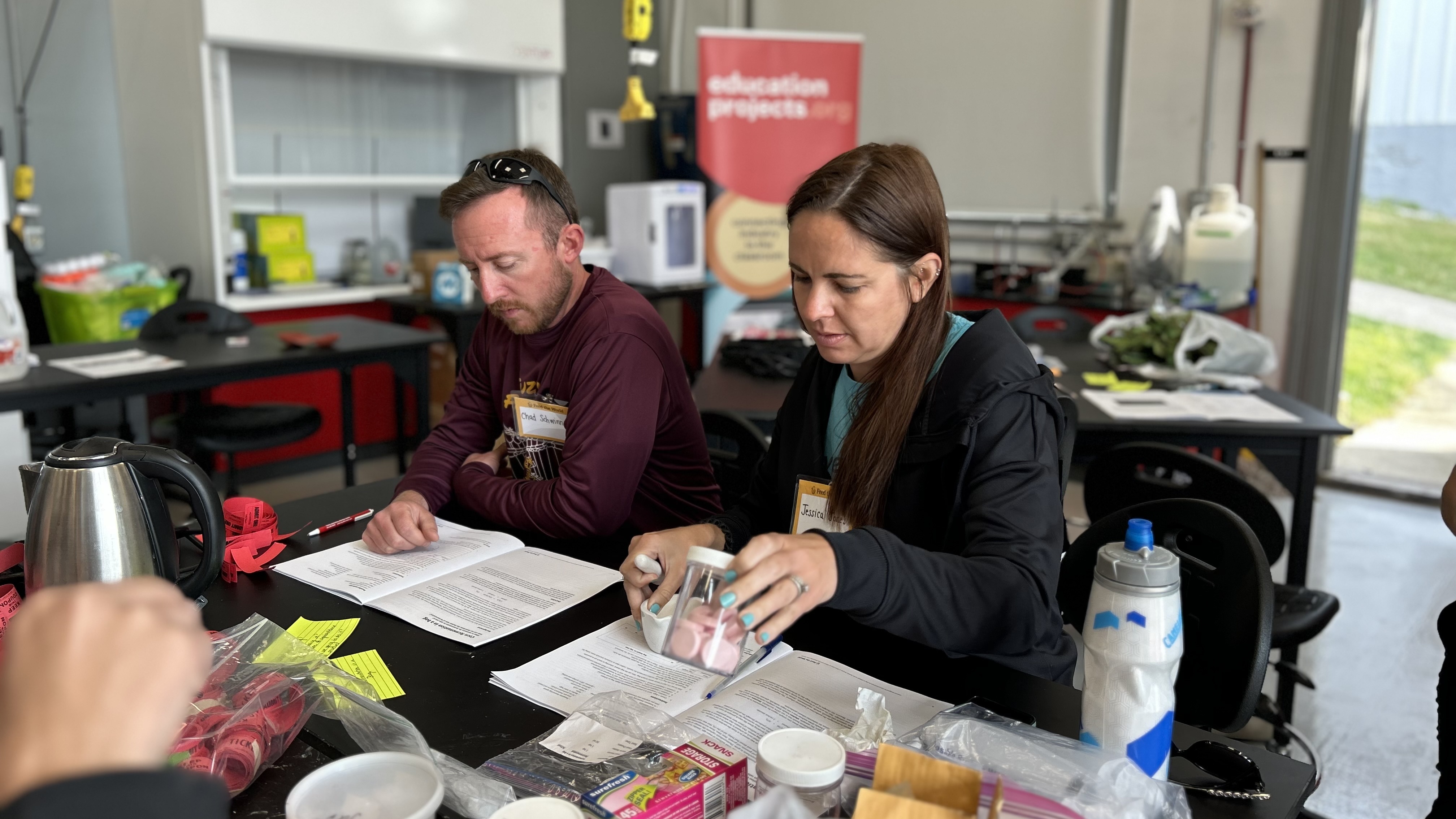 Biology teachers Chad Schwinnen of New Albany and Jessica Jones of Olmsted Falls do hands-on life science through agriculture.